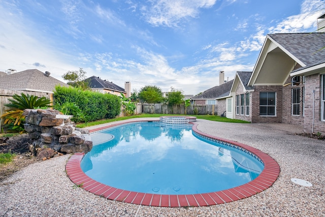 view of swimming pool featuring a patio area