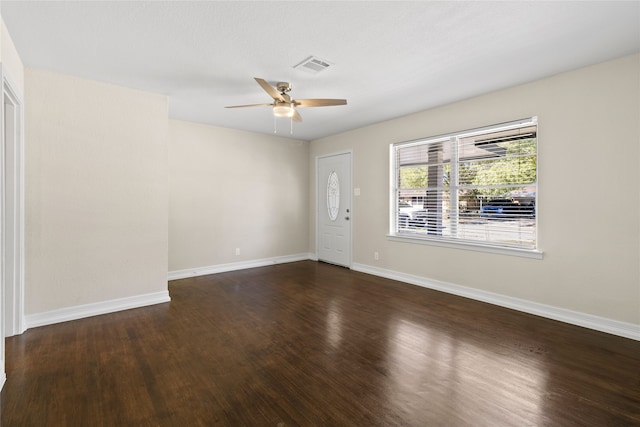 empty room featuring dark hardwood / wood-style floors and ceiling fan