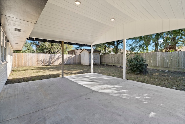 view of patio / terrace featuring a storage unit