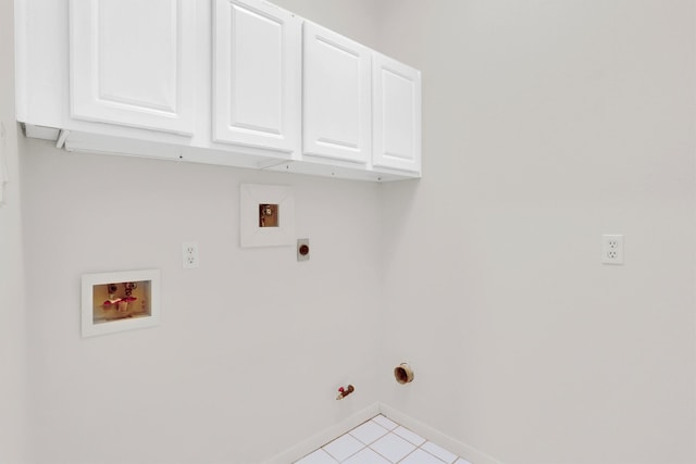 laundry area with cabinets, hookup for a washing machine, gas dryer hookup, and electric dryer hookup