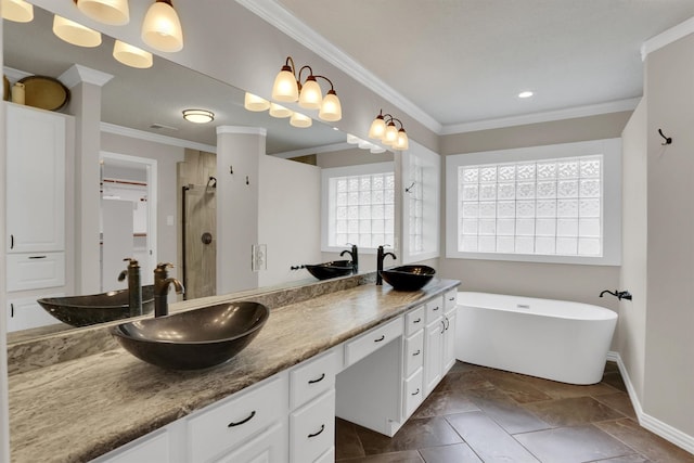 bathroom with vanity, crown molding, and independent shower and bath