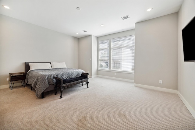 bedroom featuring light carpet