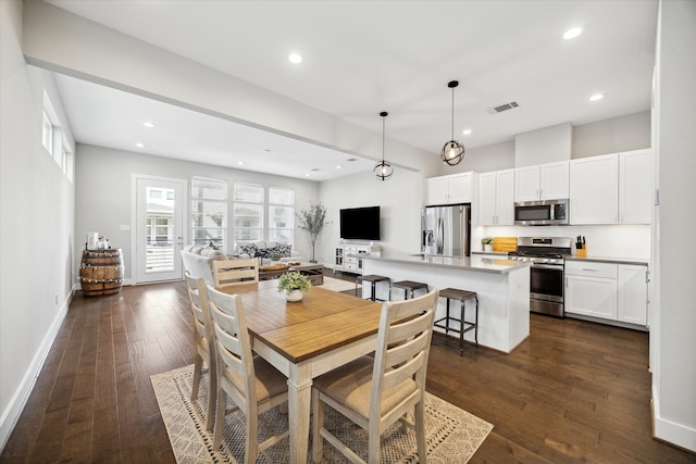 dining room with dark wood-type flooring