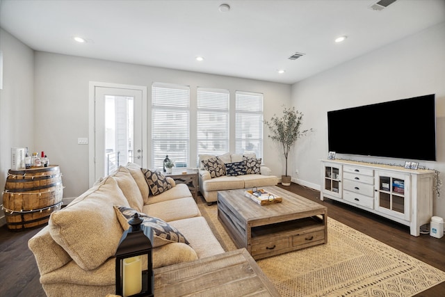 living room with dark hardwood / wood-style floors