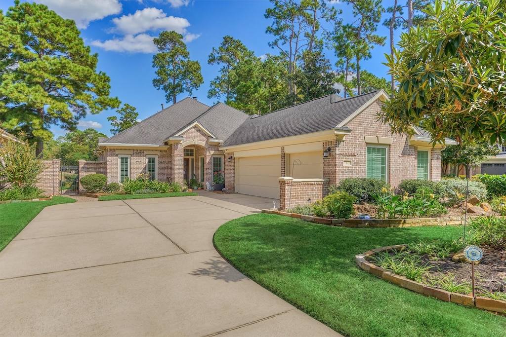 view of front facade featuring a garage and a front lawn