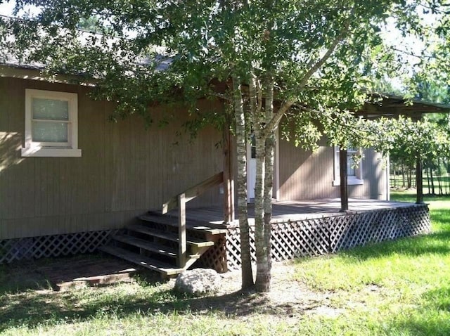 view of home's exterior with a wooden deck