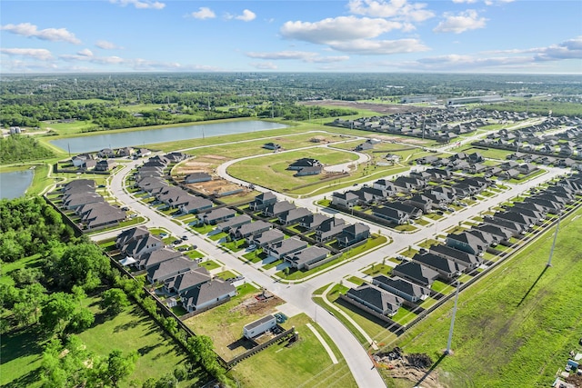 drone / aerial view with a residential view and a water view