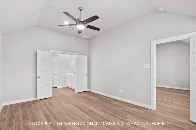 unfurnished bedroom featuring lofted ceiling, ceiling fan, and light hardwood / wood-style flooring