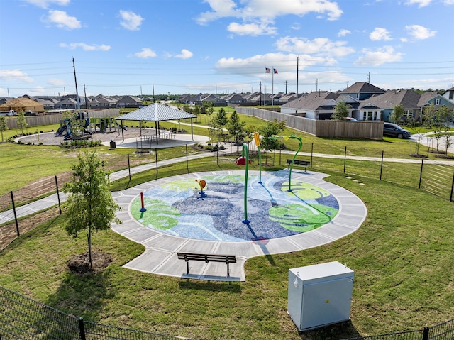 view of home's community with a gazebo, a lawn, fence, and a residential view