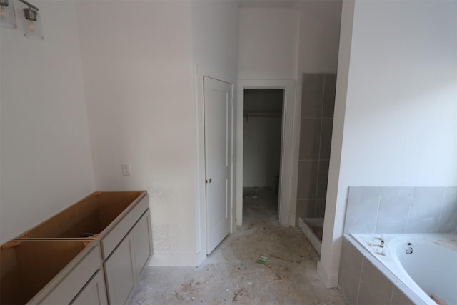 bathroom with tiled bath