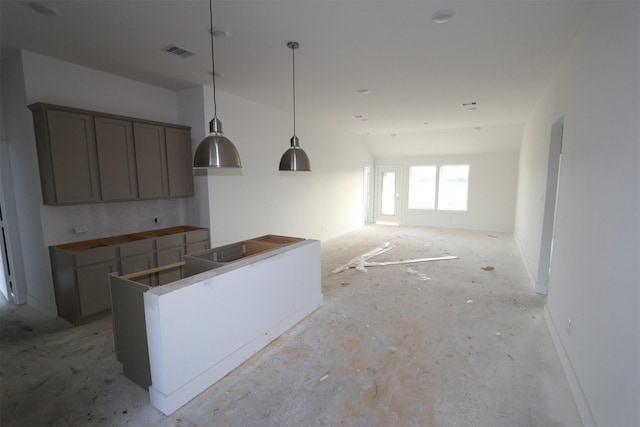 kitchen with vaulted ceiling and a center island