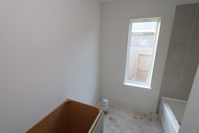 bathroom featuring a washtub