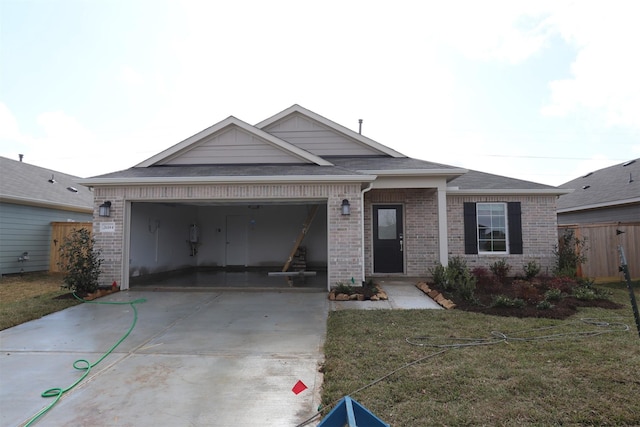 view of front of home with a garage and a front yard