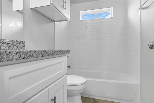 full bathroom with vanity, toilet, and tiled shower / bath