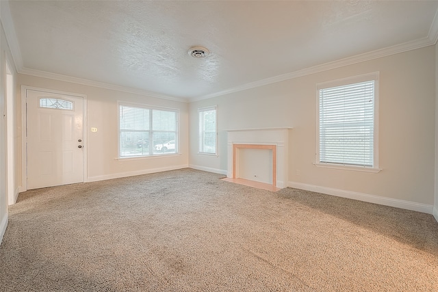 unfurnished living room featuring crown molding, a textured ceiling, and carpet flooring