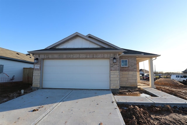 single story home featuring a garage