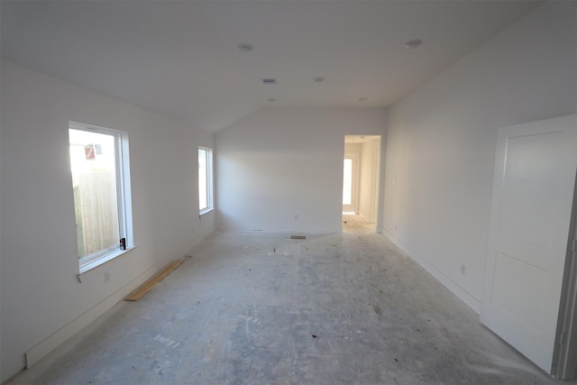 empty room with lofted ceiling