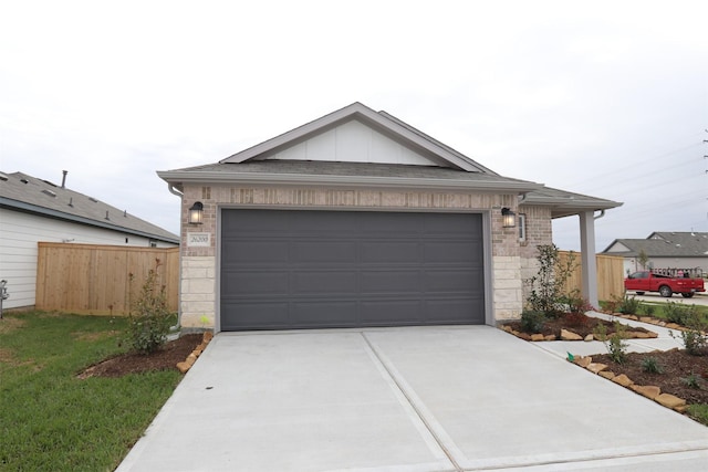 ranch-style house featuring an attached garage, brick siding, fence, driveway, and board and batten siding