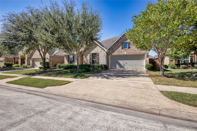 view of front of home featuring a front yard and a garage