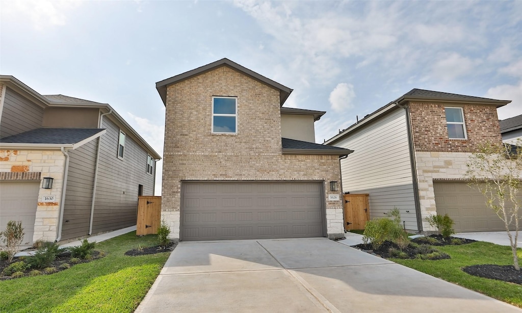 1626 Revolution Way, Missouri City, TX 77459 - traditional-style house featuring stone siding, brick siding, concrete driveway, and an attached garage