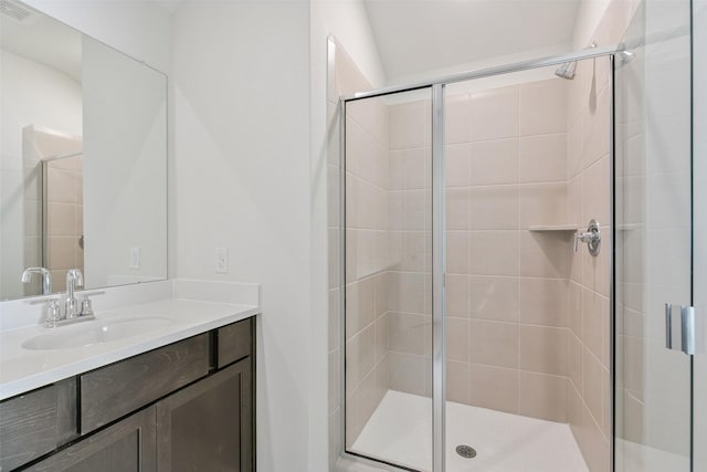 full bath featuring visible vents, a shower stall, and vanity