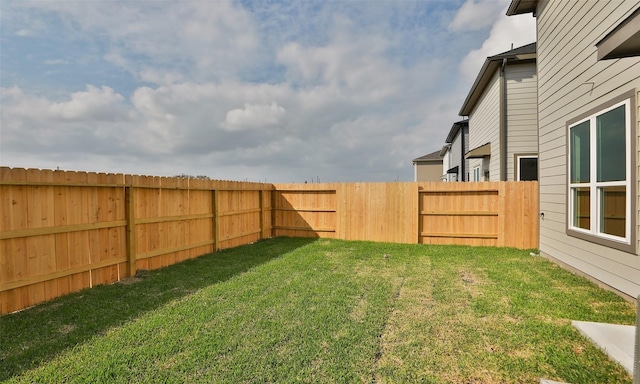 view of yard featuring a fenced backyard