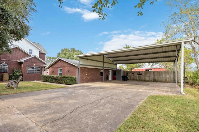 view of front facade featuring a front yard and a carport