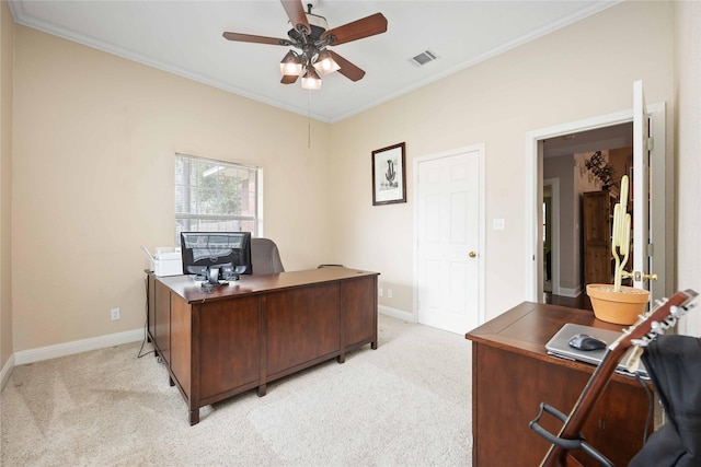 carpeted office space featuring ceiling fan and crown molding