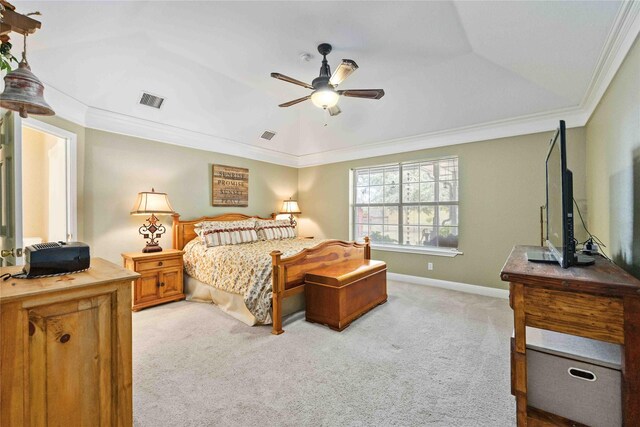 carpeted bedroom featuring ceiling fan and ornamental molding