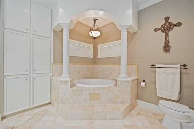 bathroom featuring tiled bath, toilet, and crown molding