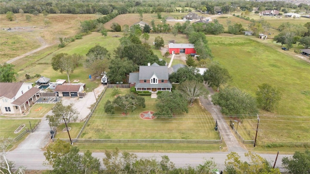 birds eye view of property with a rural view