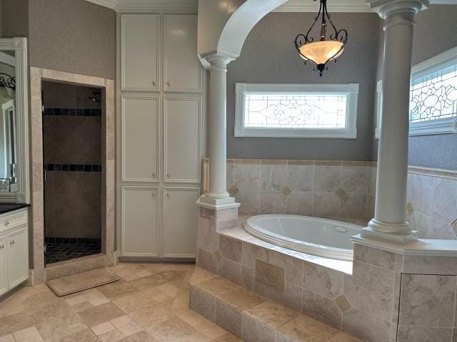 bathroom featuring vanity, ornate columns, and plus walk in shower