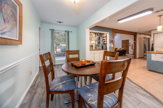 dining space featuring light wood-type flooring