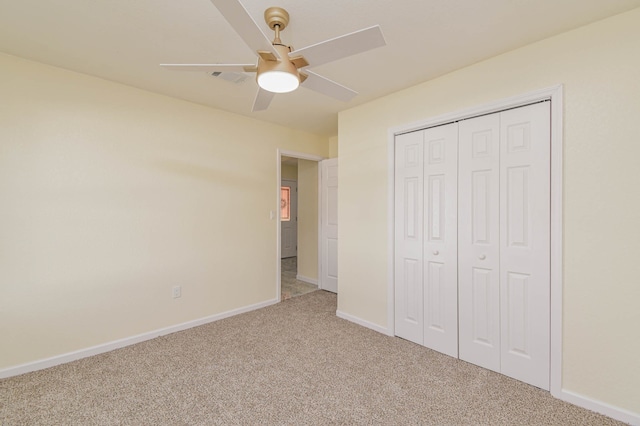 unfurnished bedroom with a closet, carpet floors, and ceiling fan