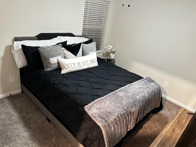 carpeted bedroom featuring baseboards