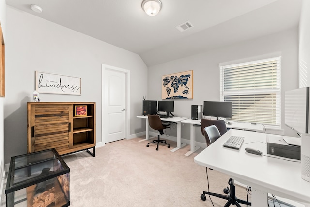 office featuring light carpet and lofted ceiling