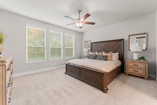 bedroom with light colored carpet and ceiling fan