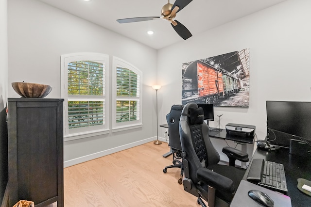 office space with light hardwood / wood-style flooring and ceiling fan