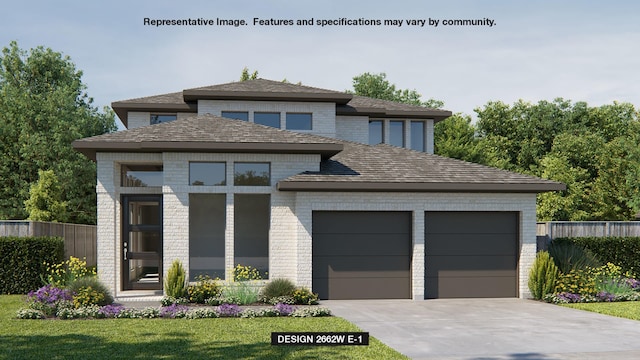 view of front of house featuring a front lawn and a garage