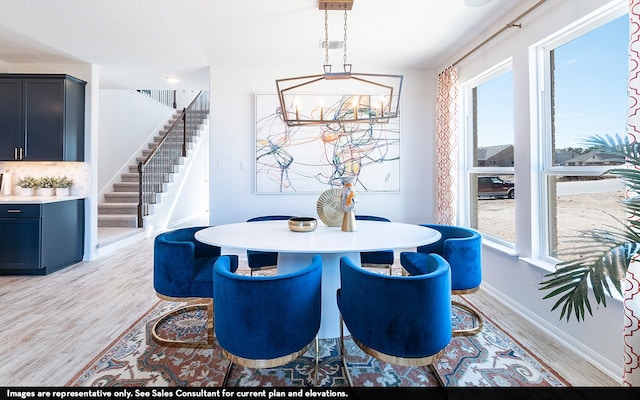 dining area with light hardwood / wood-style floors