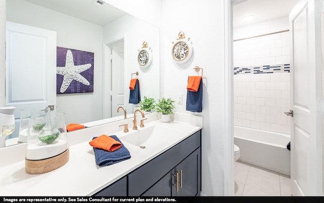 full bathroom with vanity, toilet, tile patterned floors, and tiled shower / bath