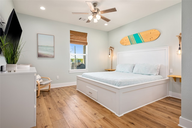 bedroom with light wood-type flooring and ceiling fan