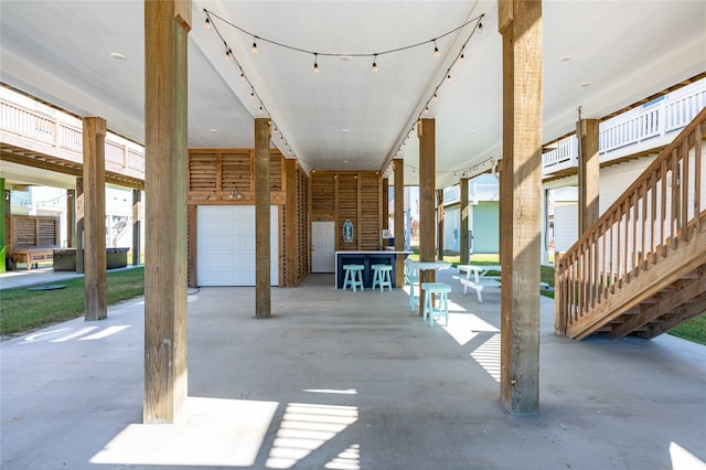 view of patio / terrace featuring a garage