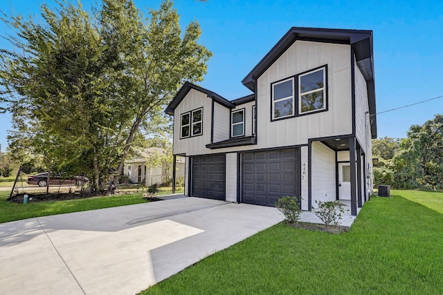 view of front facade with cooling unit, a garage, and a front lawn