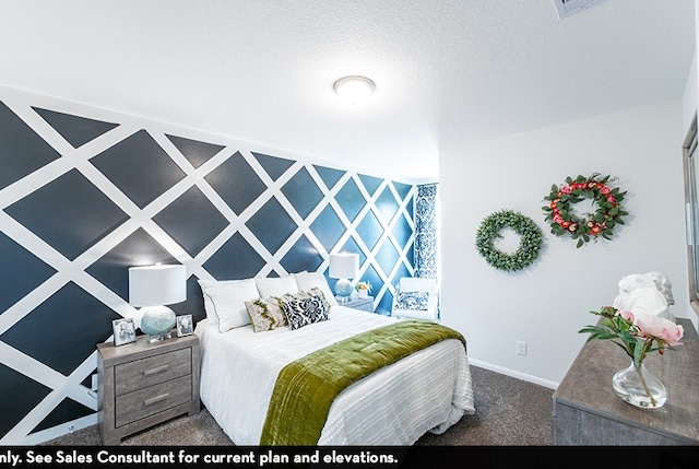 carpeted bedroom with a textured ceiling