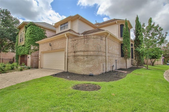 view of home's exterior with a yard and a garage