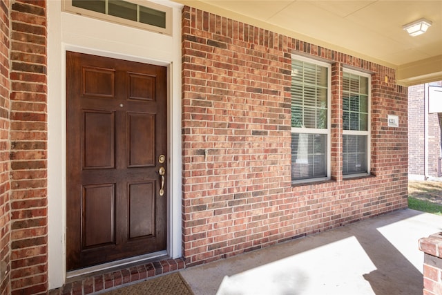 property entrance with covered porch