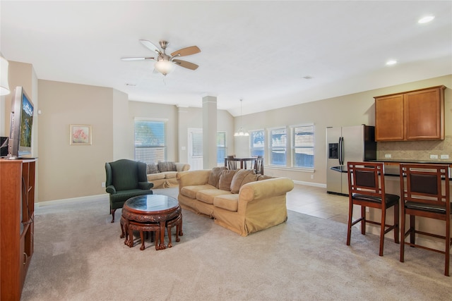 carpeted living room featuring ceiling fan