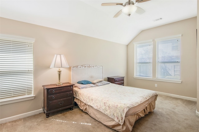 carpeted bedroom with ceiling fan and lofted ceiling