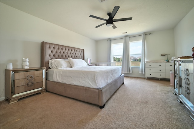 carpeted bedroom featuring ceiling fan